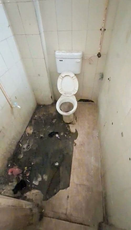 Deteriorated hospital washroom before renovation (4)